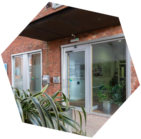 Exterior view of the Syscomm office entrance, featuring glass doors and company branding