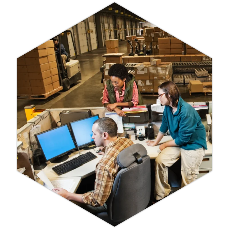 workers studying documents on computer at depot high res v2