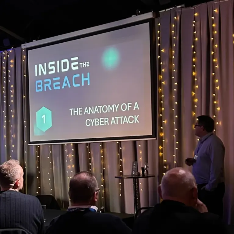 Chris Tyler presenting the anatomy of a cyber attack to business leaders at Inside the Breach, Crystal Maze Manchester