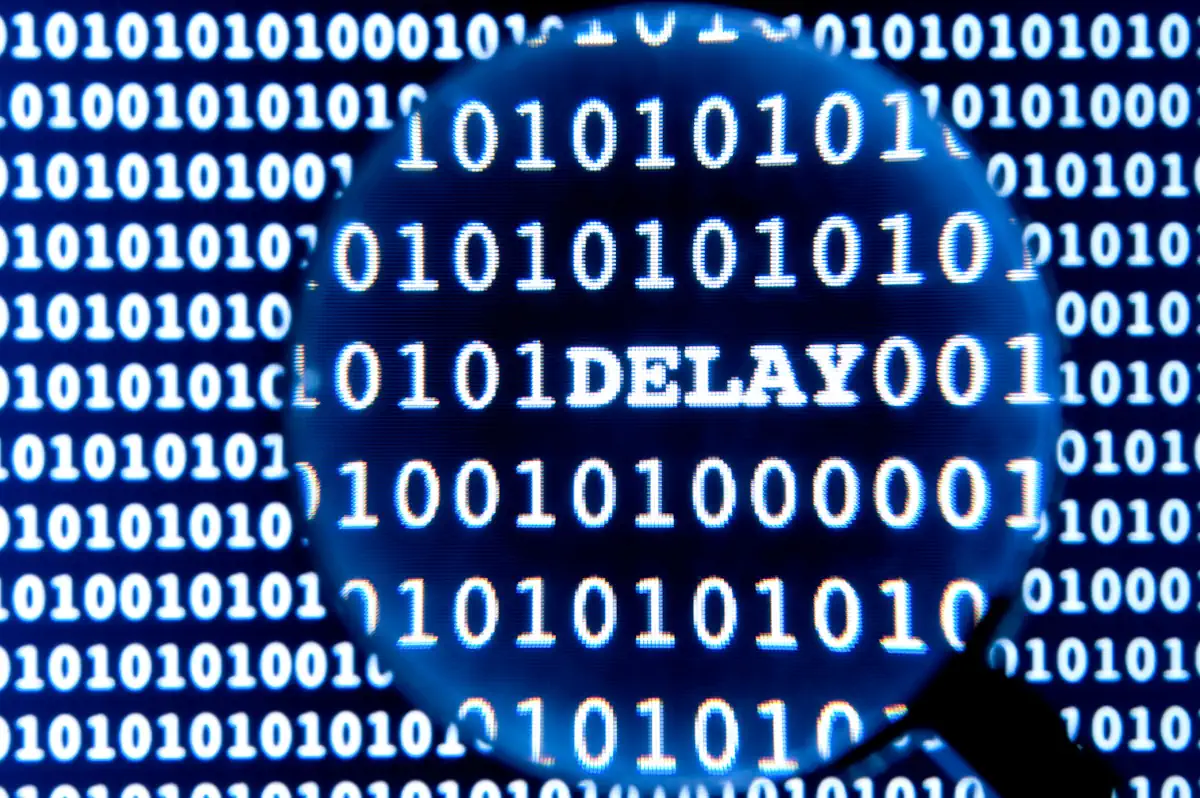 Magnifying glass over blue binary code highlighting the word delay