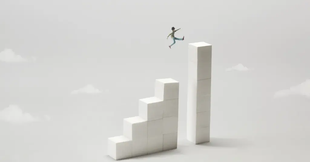 Small figure leaping across a gap from a staircase of white blocks to a taller column, representing ransomware recovery